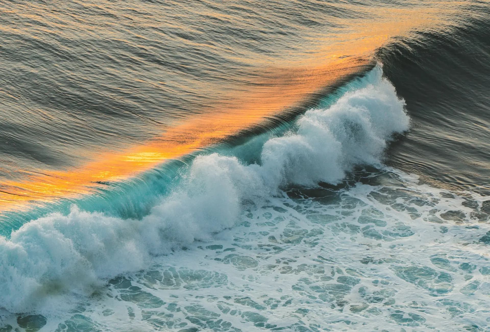 A wave breaking at golden hour